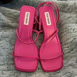 Fuchsia sparkly strappy heels.